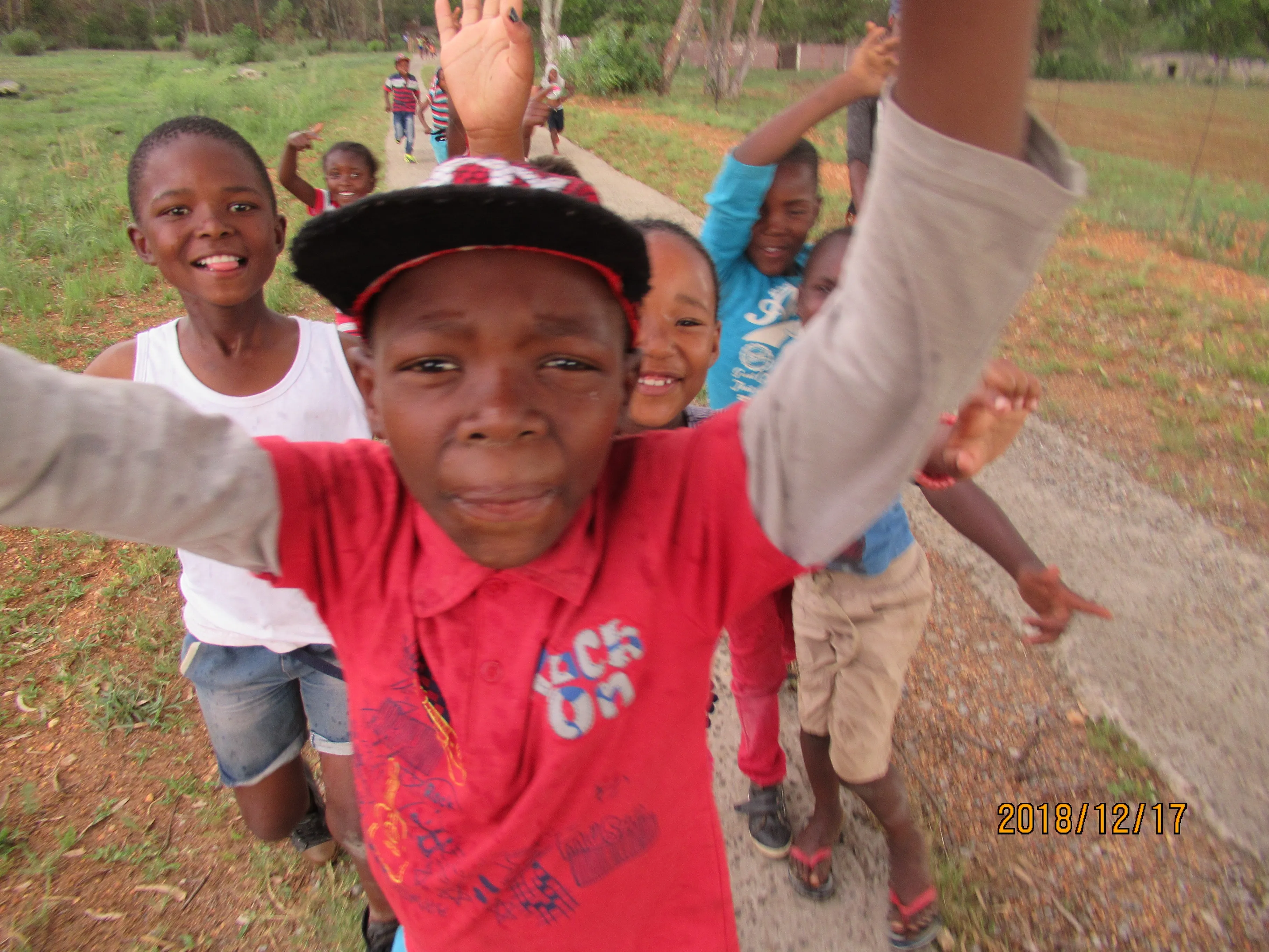 Some happy kids outside being free at a christmas party held by the centre 
