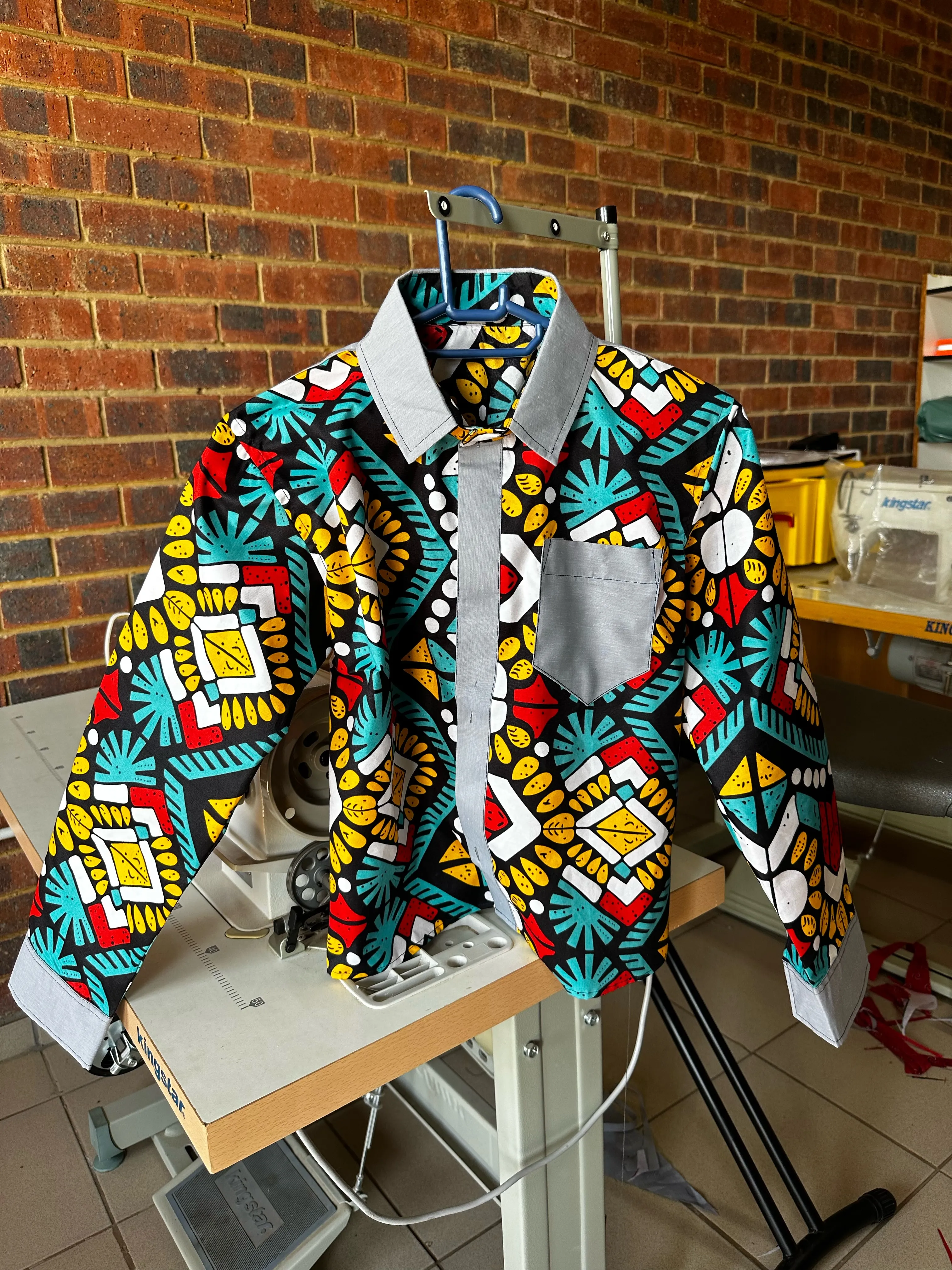 Sewing products - colorful shirt made in the sewing side of St Bonaventure Centre 
